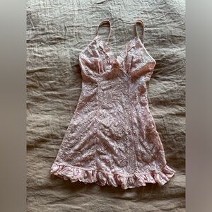 SOLD Baby Pink lace ruffled slip with a floral pattern and ruffle hem.